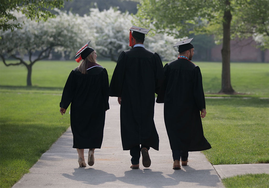 Graduates walk on campus