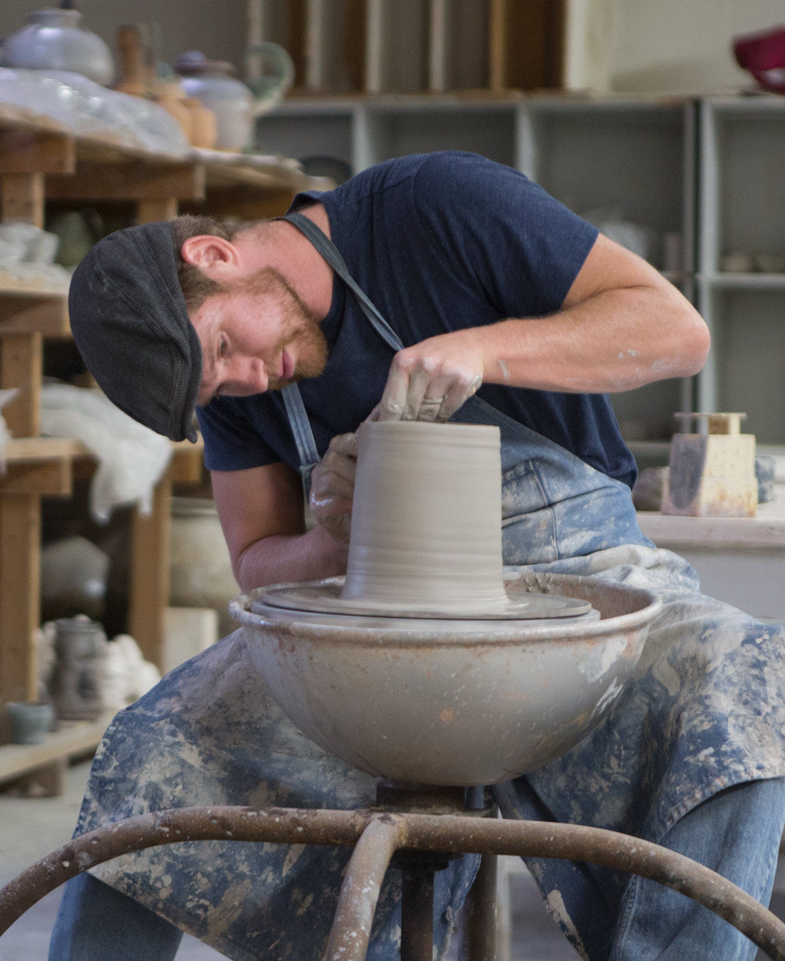 Andrew Steingass, adjunct instructor of art, works with clay in the Wilson Art Center at «Ӱҵ.