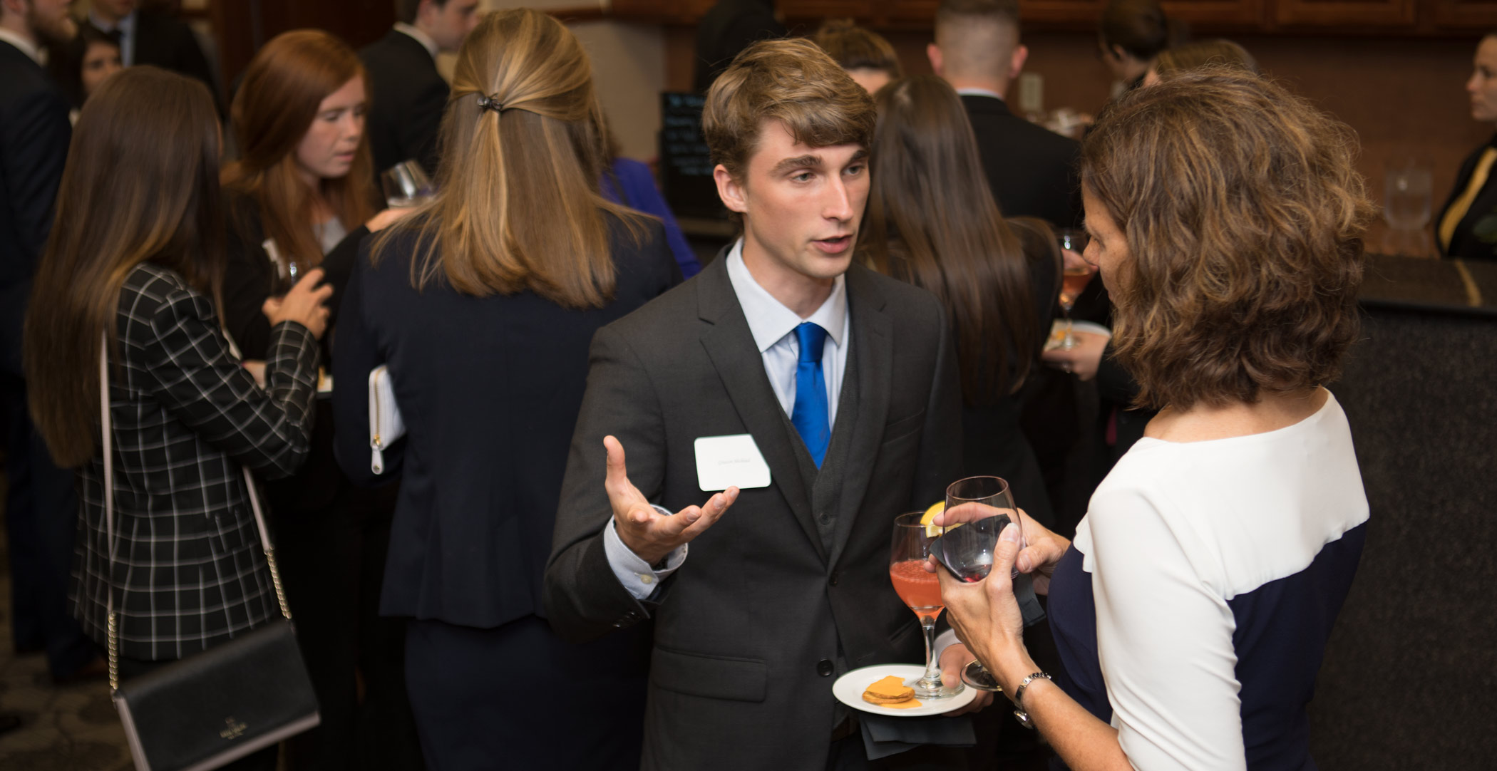 Patty Navin speaks with Graeson Michaud. 葫芦影业 Dicke College of Business Administration juniors participated in an etiquette dinner at The Inn at 葫芦影业.