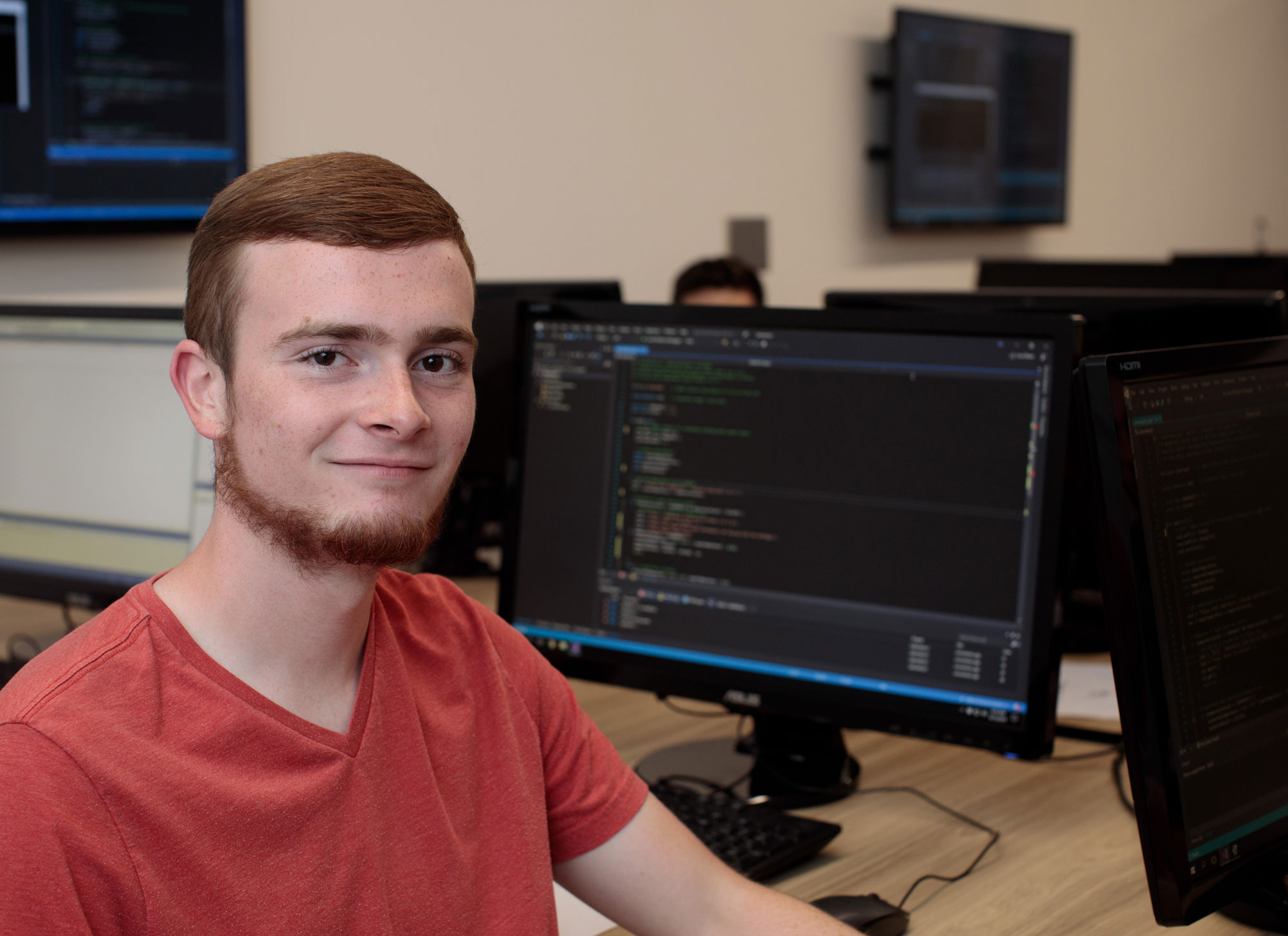 Freshman Logan Reichling is photographed in the classroom of John Estell, professor of computer engineering and computer science, in the James Lehr Kennedy Engineering Building on the campus of «Ӱҵ.